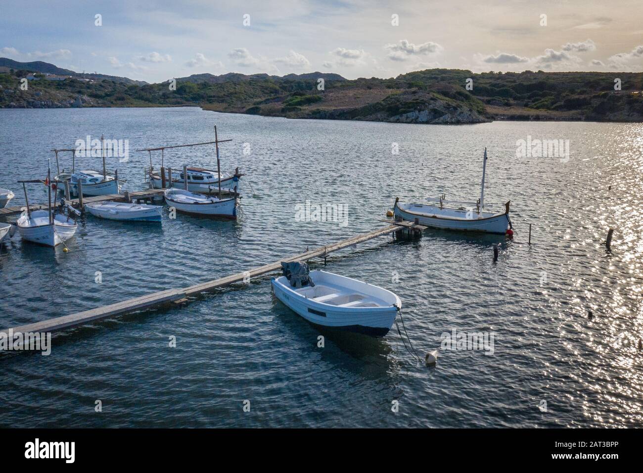 Spanish fishing boats moored in natural harbour Stock Photo