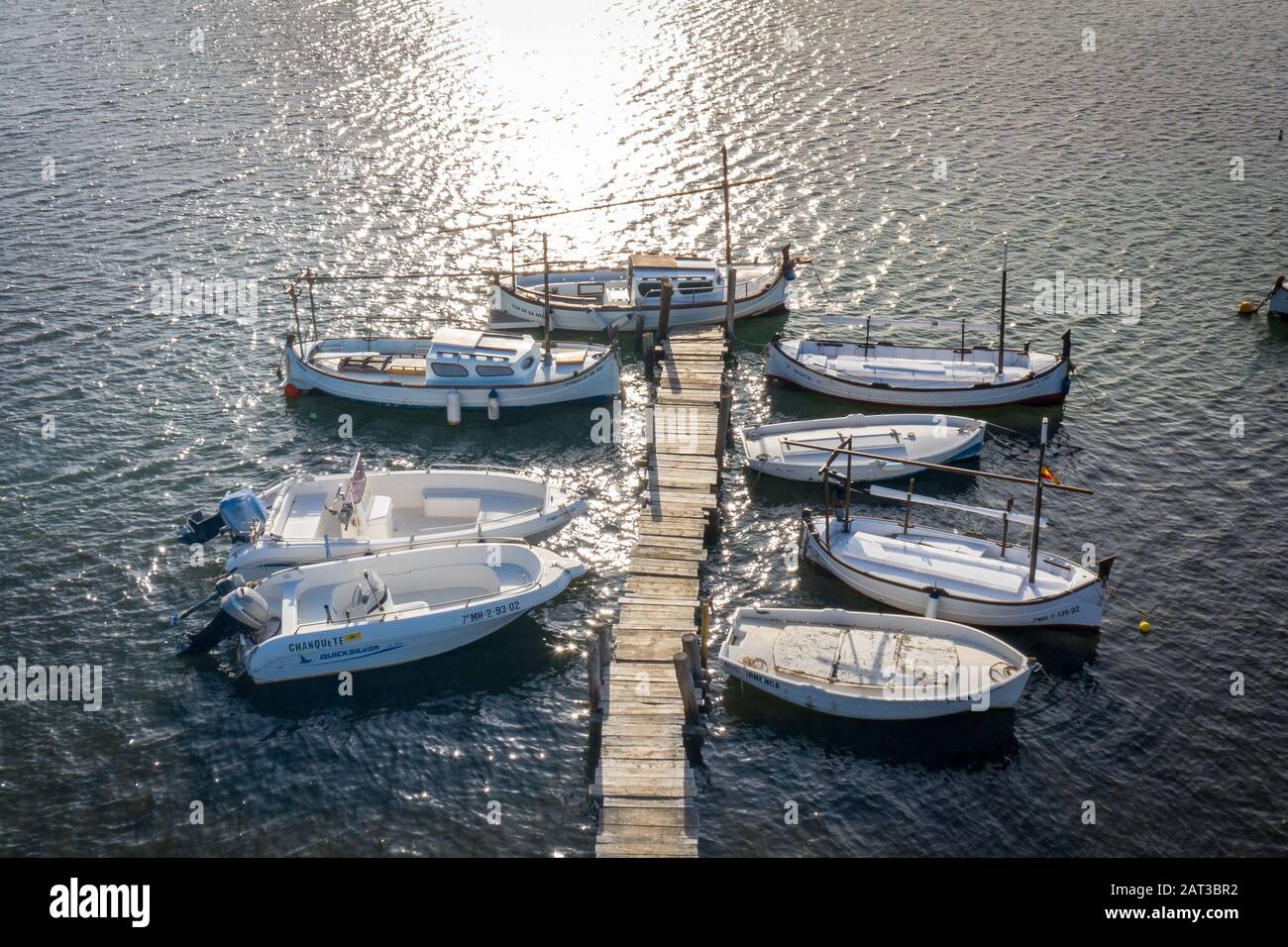 Spanish fishing boats moored in golden hour Stock Photo