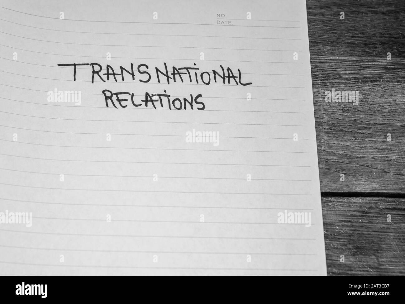 Transnational relations, handwriting text on paper, political message. Political text on office agenda. Concept of democracy, voting, politics. Copy Stock Photo