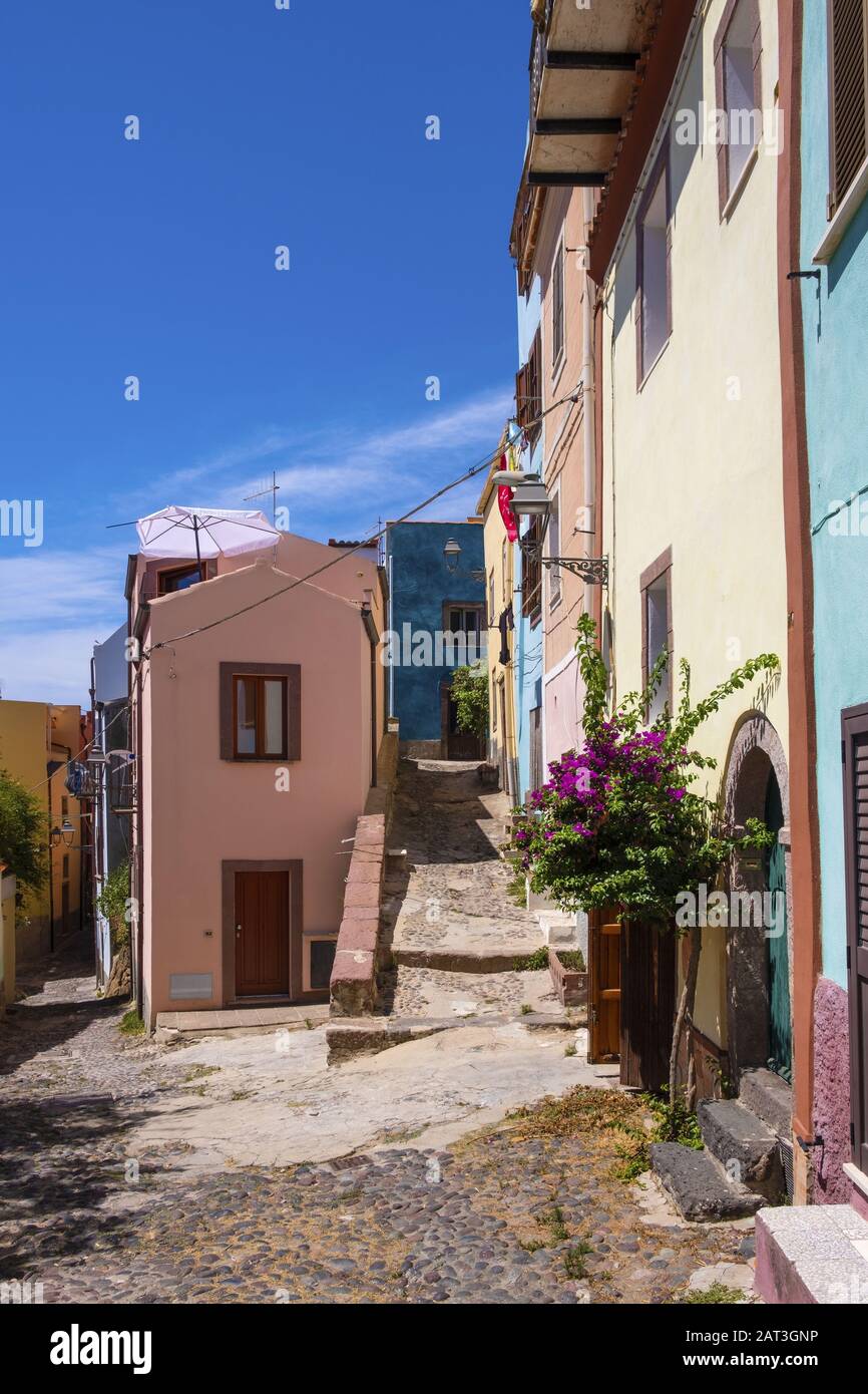 Bosa, Sardinia / Italy - 2018/08/13: Bosa historic old town quarter with colorful tenements and narrow street of Via Muruidda Stock Photo