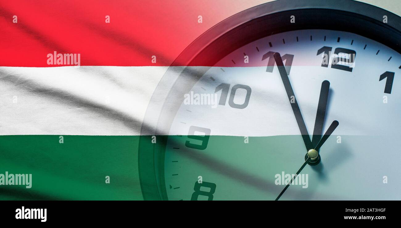 Hungary flag with dial of a clock Stock Photo