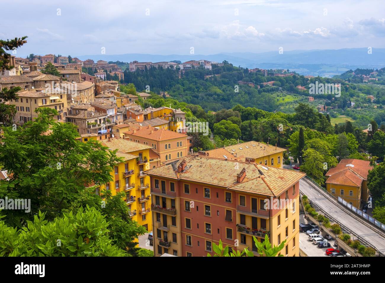 Perugia, Umbria / Italy - 2018/05/28: Panoramic view of the Perugia historic quarter with medieval houses and defense walls and surrounding Umbria region valleys Stock Photo