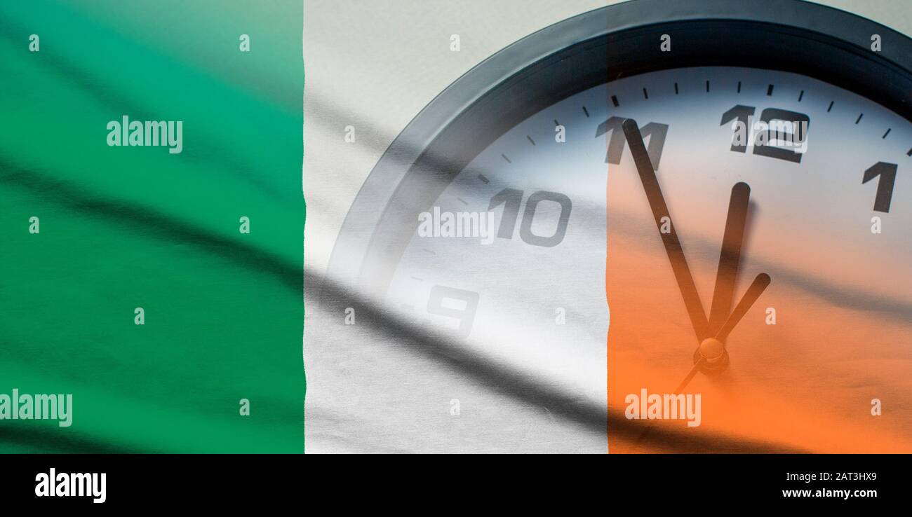 Ireland flag with dial of a clock Stock Photo