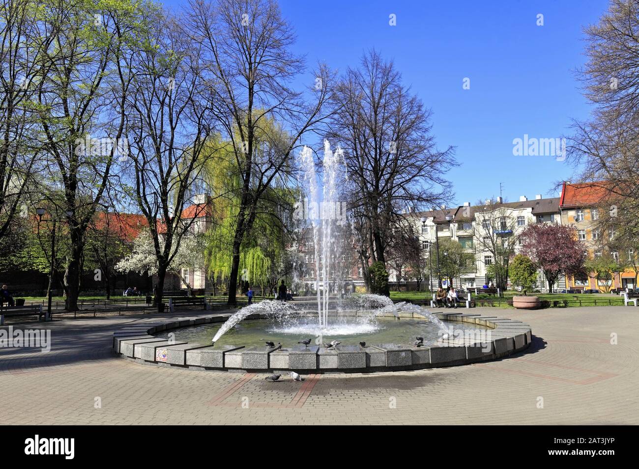 Katowice, Silesia / Poland - 2019/04/18: Panoramic view of the city park and fountain of the Plac Andrzeja square - Andrew square - in Katowice Stock Photo
