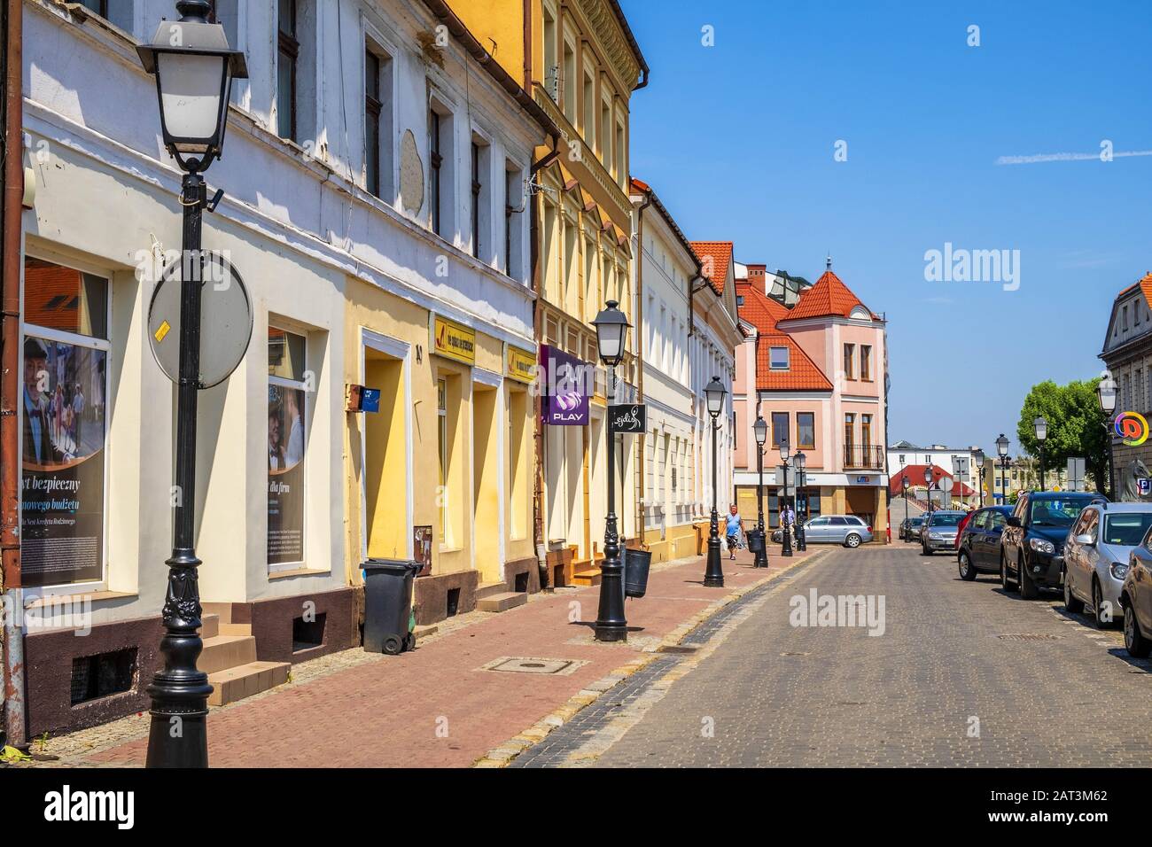 Konin, Greater Poland province / Poland - 2019/06/26: Historic tenements at the market square - Plac Wolnosci square - in the Old Town quarter of Konin, Poland Stock Photo