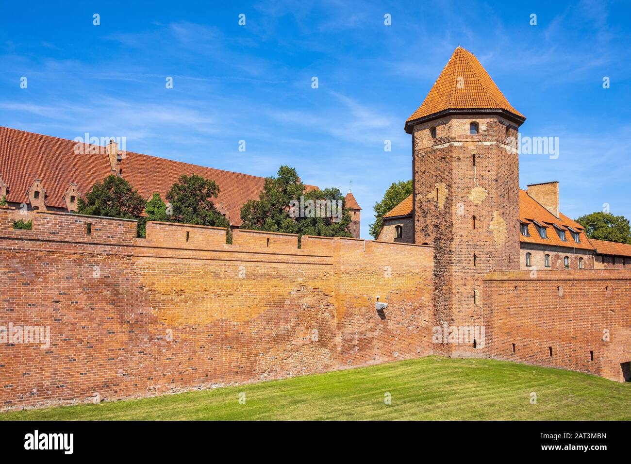 Malbork, Pomerania / Poland - 2019/08/24: Panoramic view of the medieval Teutonic Order Castle in Malbork, Poland - external defense walls, towers moat and keeps Stock Photo