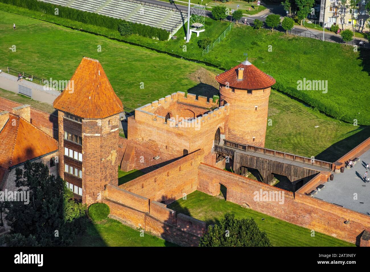 Malbork, Pomerania / Poland - 2019/08/24: Aerial panoramic view of the external defense walls, towers moat and keeps of the medieval Teutonic Order Castle in Malbork, Poland Stock Photo