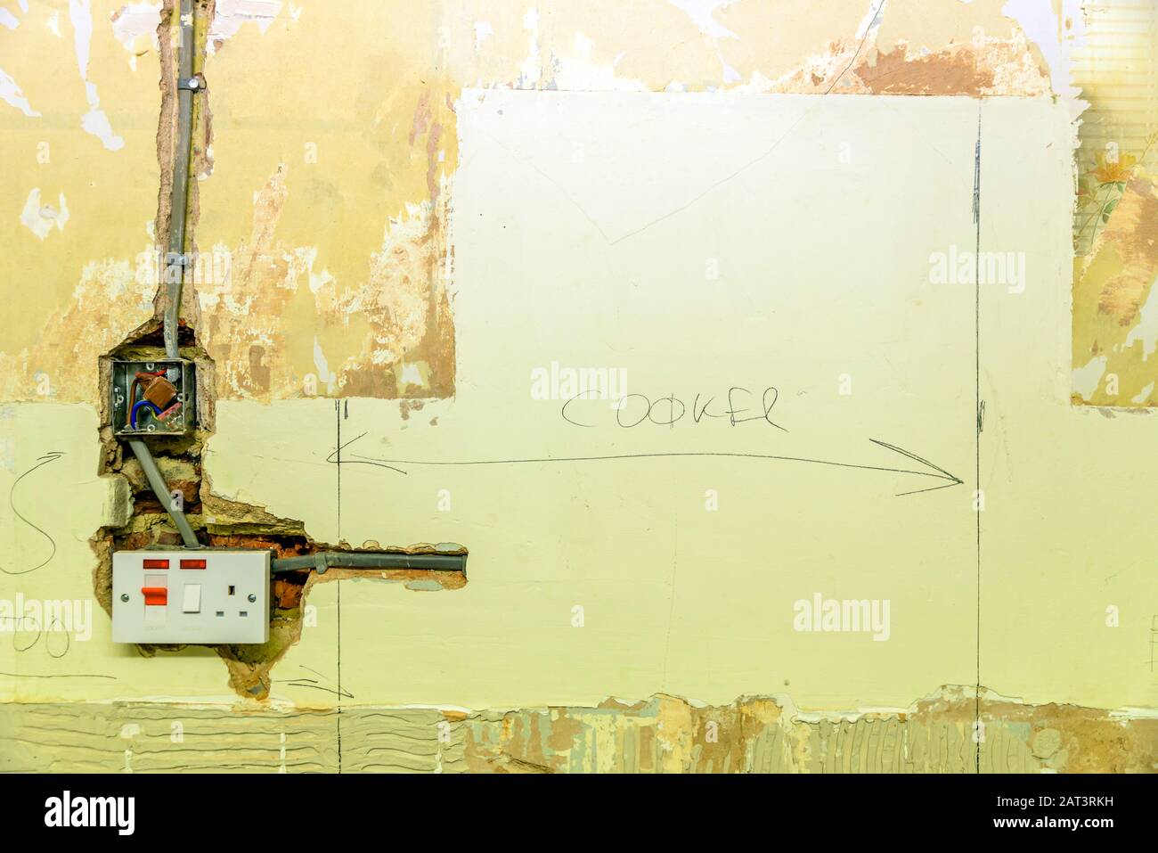 electric socket in a wall during renovation in england uk Stock Photo