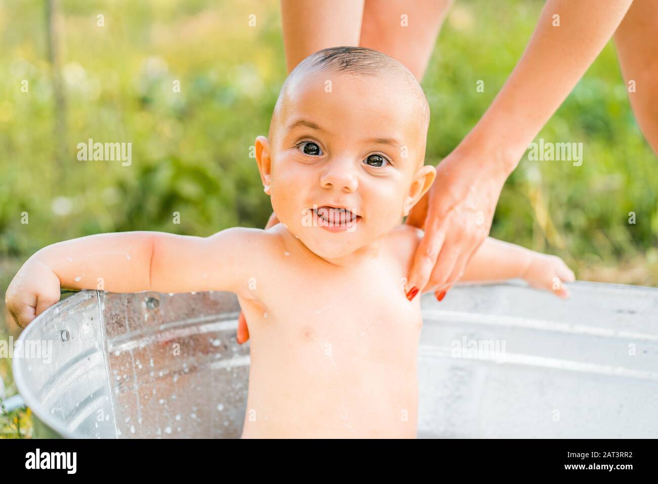 Cute little smiling baby boy portrait in milk bath. Healthy lifestyle