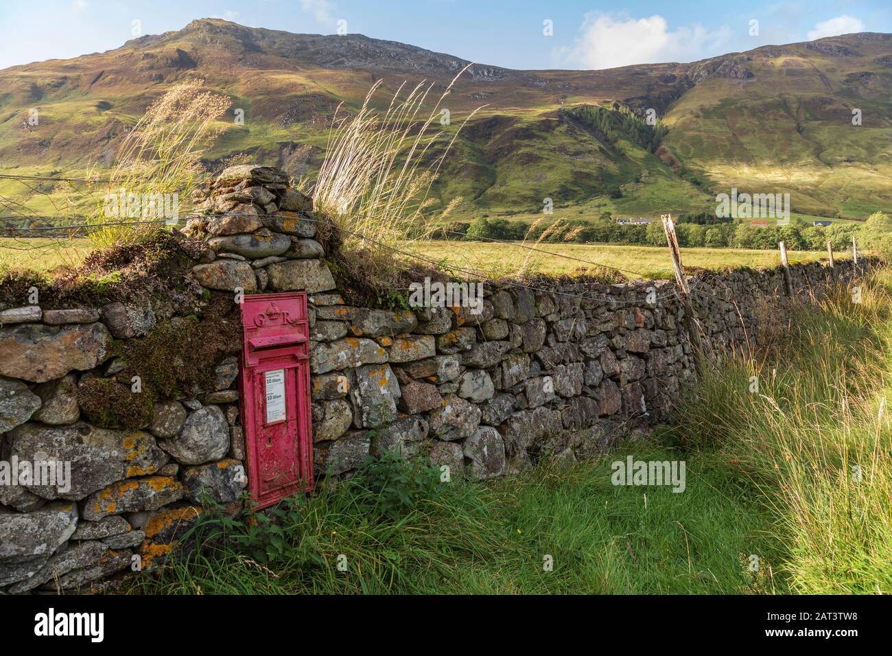 Postbox in the village of Morvich, Western Scotland. The mountain behind is Sgùrr An Airgid. Stock Photo