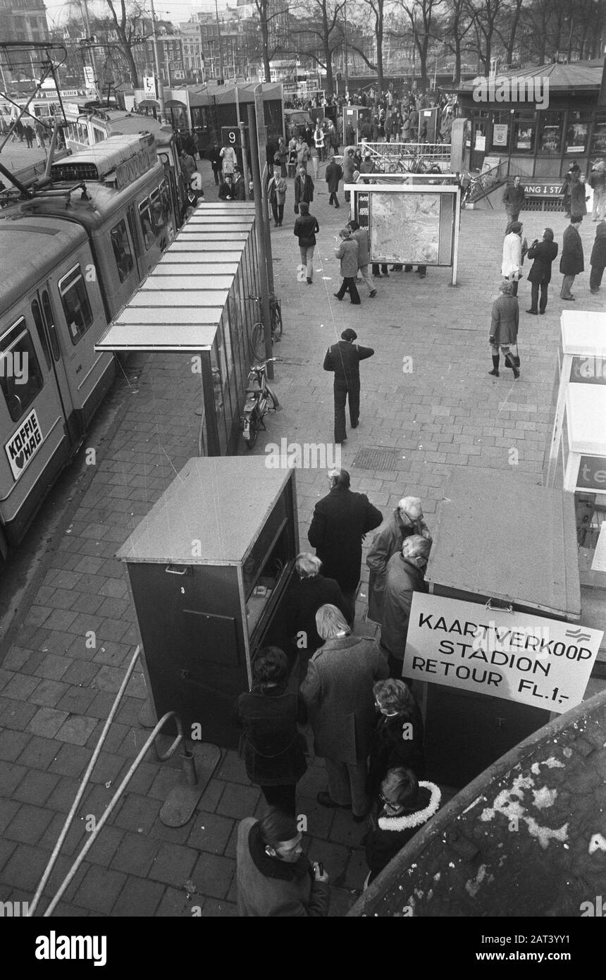 Visitors to the interland Netherlands-Belgium in the Olympic Stadium in Amsterdam come by public transport in connection with the car-free Sunday  In the hall of the Central Station bus tickets are sold for transportation to the stadium Date: 18 November 1973 Location: Amsterdam, Noord-Holland Keywords: carless Sunday, visitors, interland, oil boycott, stations, football Stock Photo