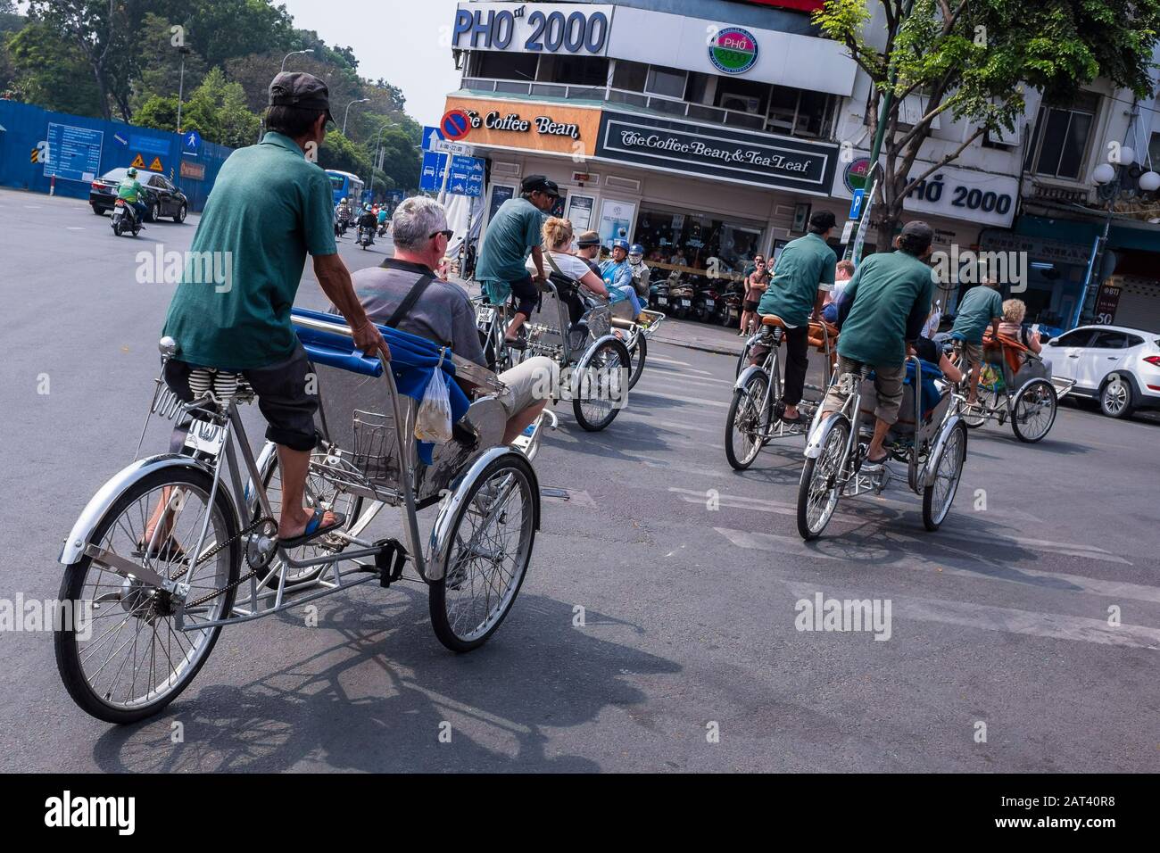 Group of tourists travelling by cyclo around the city, Ho Chi Minh City, Vietnam Stock Photo