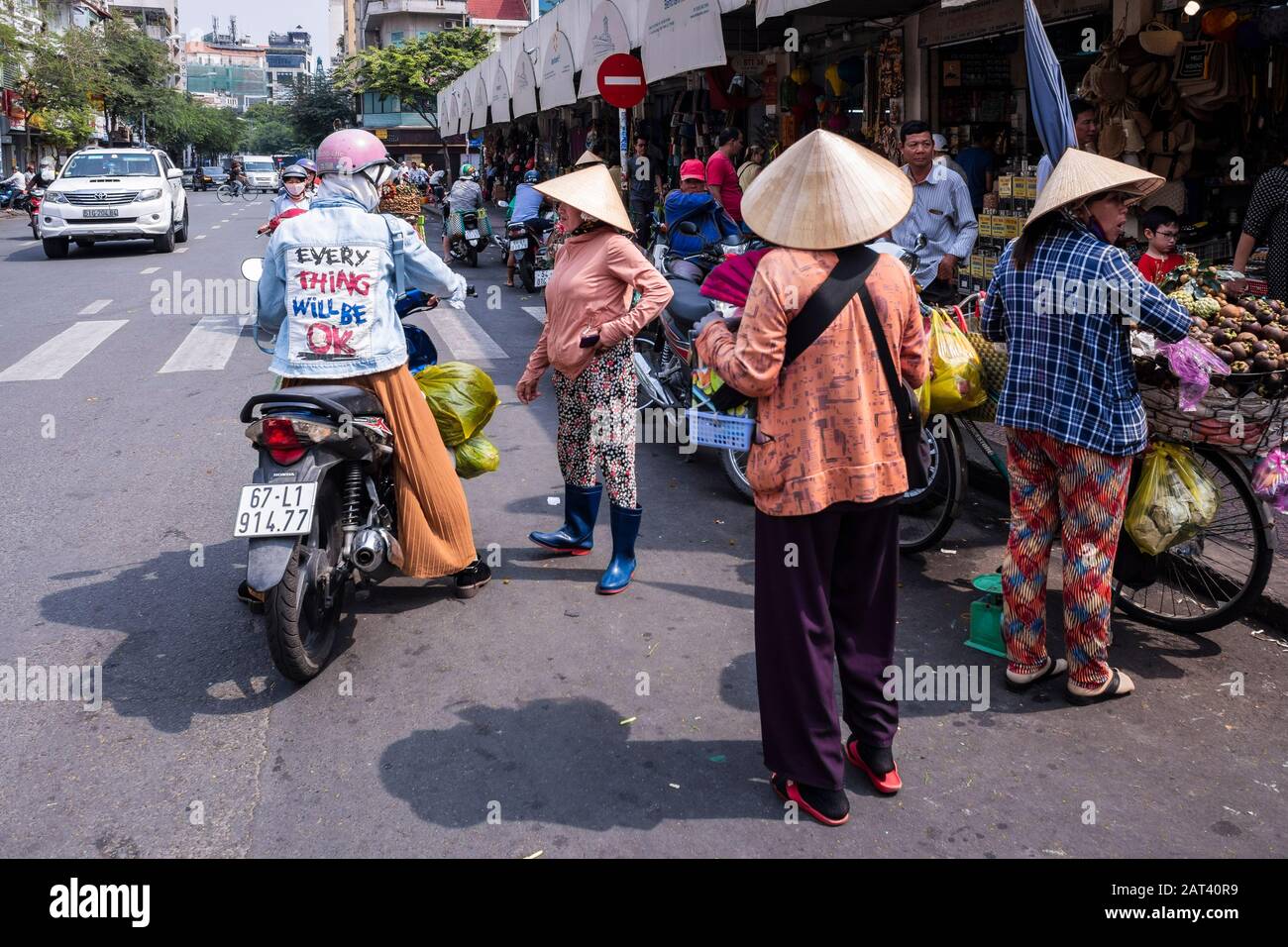Women street vendor's outside of Ben Thanh market, Ho Chi Minh City, Vietnam Stock Photo