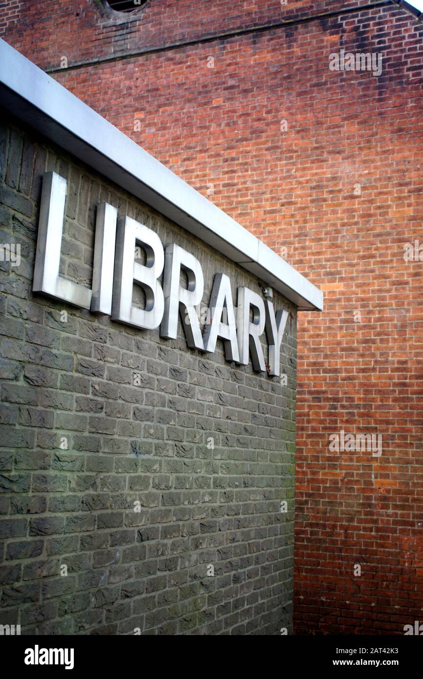 A sign for a library on a brick wall in the UK Stock Photo - Alamy