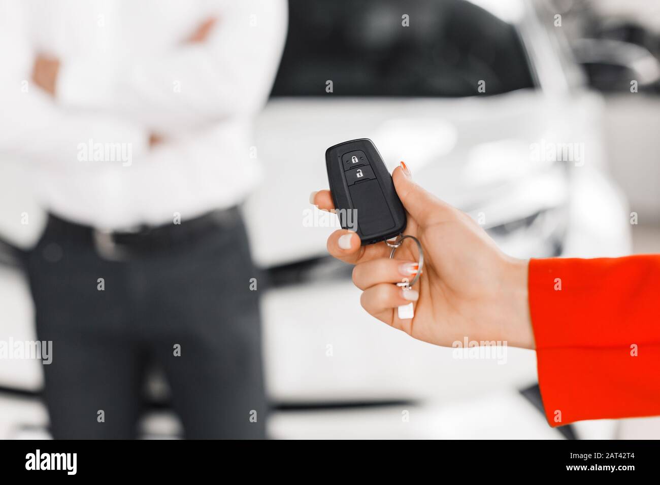 Closeup car key in female hand. - Image Stock Photo - Alamy