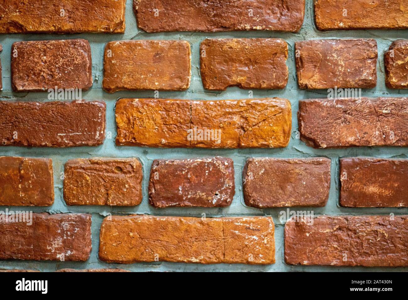 Weathered stained old brick wall background Stock Photo