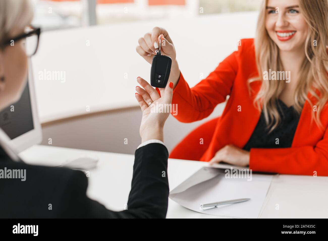 Car dealer giving key client hi-res stock photography and images - Alamy