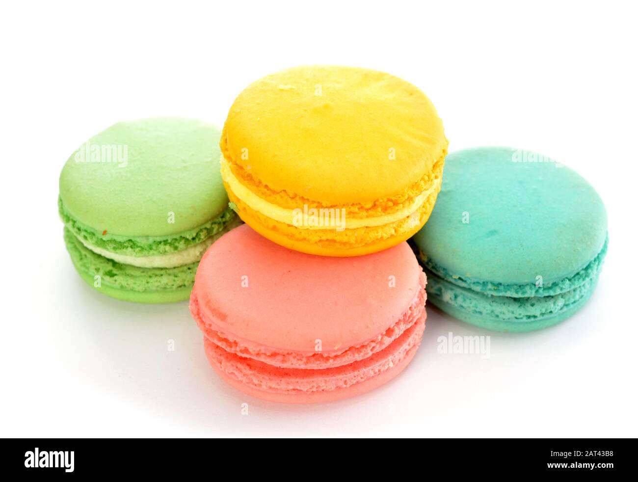 Four macaroon cakes on white background Stock Photo - Alamy