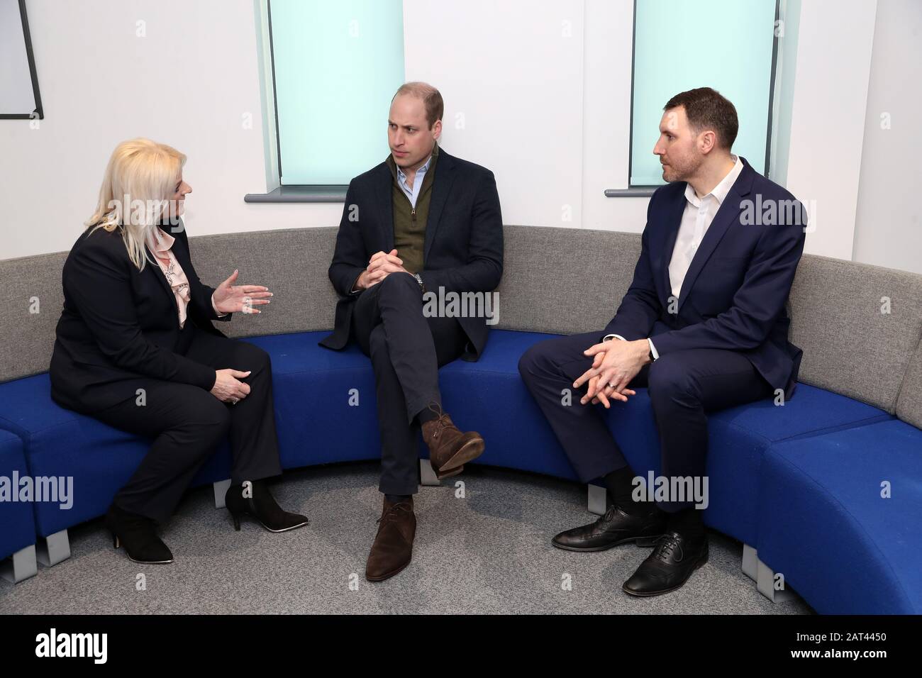 The Duke of Cambridge (centre) talks to Denise Barrett-Baxendale (left), CEO Everton football Club and Michael Salla (right), Director of Health and Sport, Everton football Club, during a visit to Everton in the Community, the official charity of Everton football Club, in Liverpool, as he visits the club's charity to raise awareness of the Heads Up mental health campaign. Stock Photo