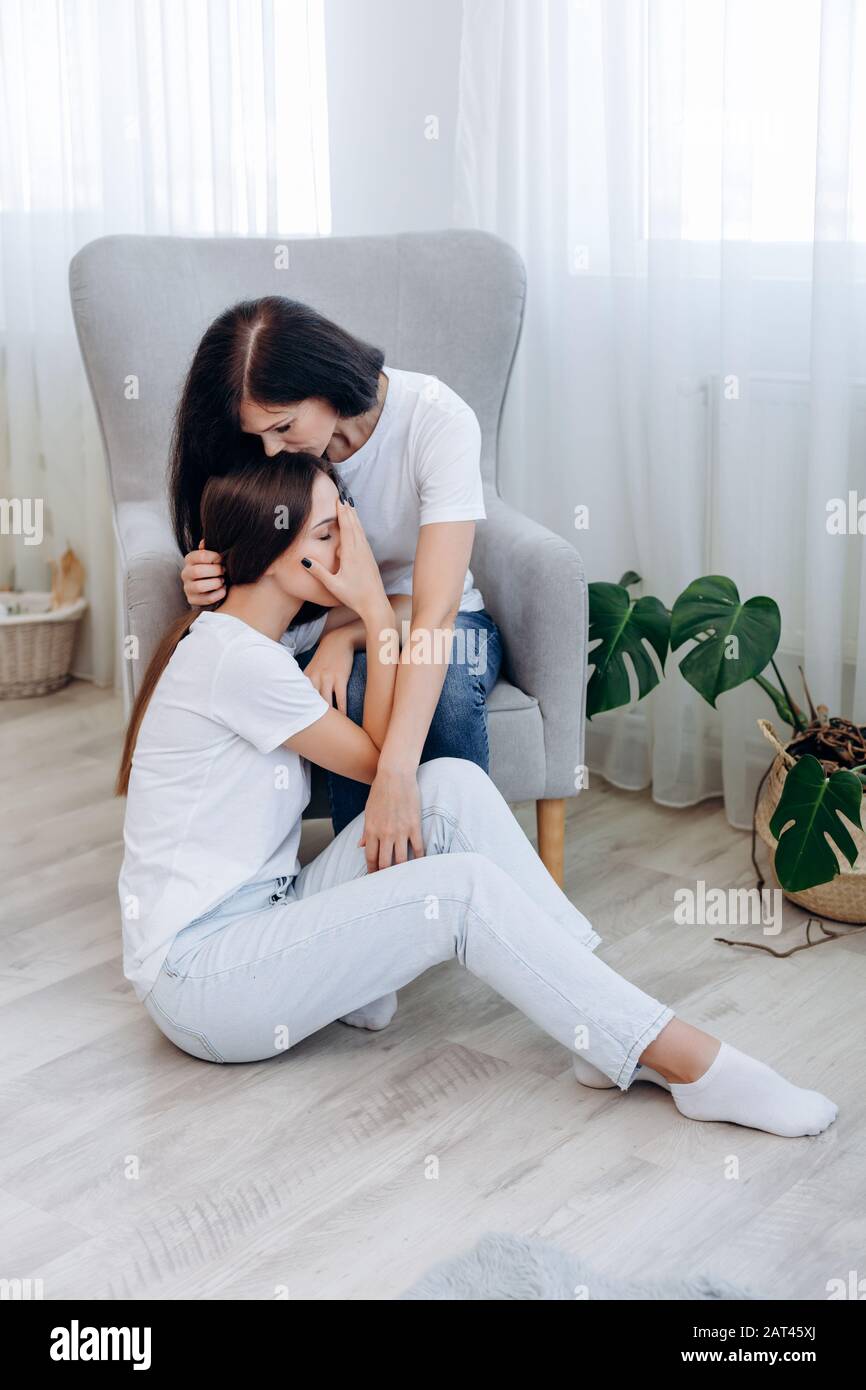 Girl Crying Next to a Kissing Couple