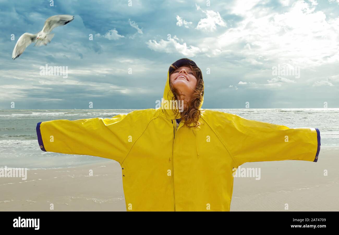 Happy Young Woman On The Beach ( North Sea ) Stock Photo