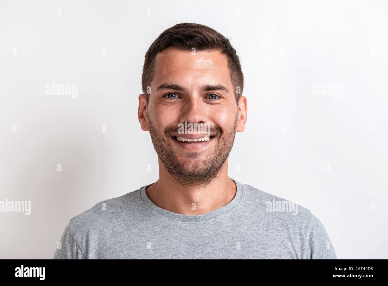 Closeup male studio portrait of happy man looking at the camera.- Image Stock Photo