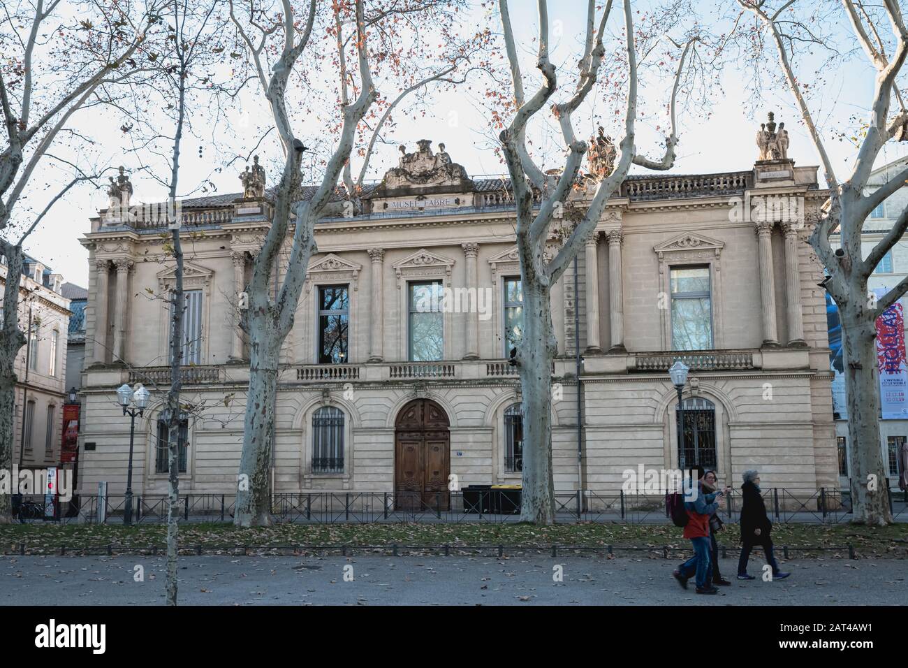 Montpellier, France - January 2, 2019: architectural detail of the Fabre museum next to the Place de la Comedie where people pass on a winter day Stock Photo