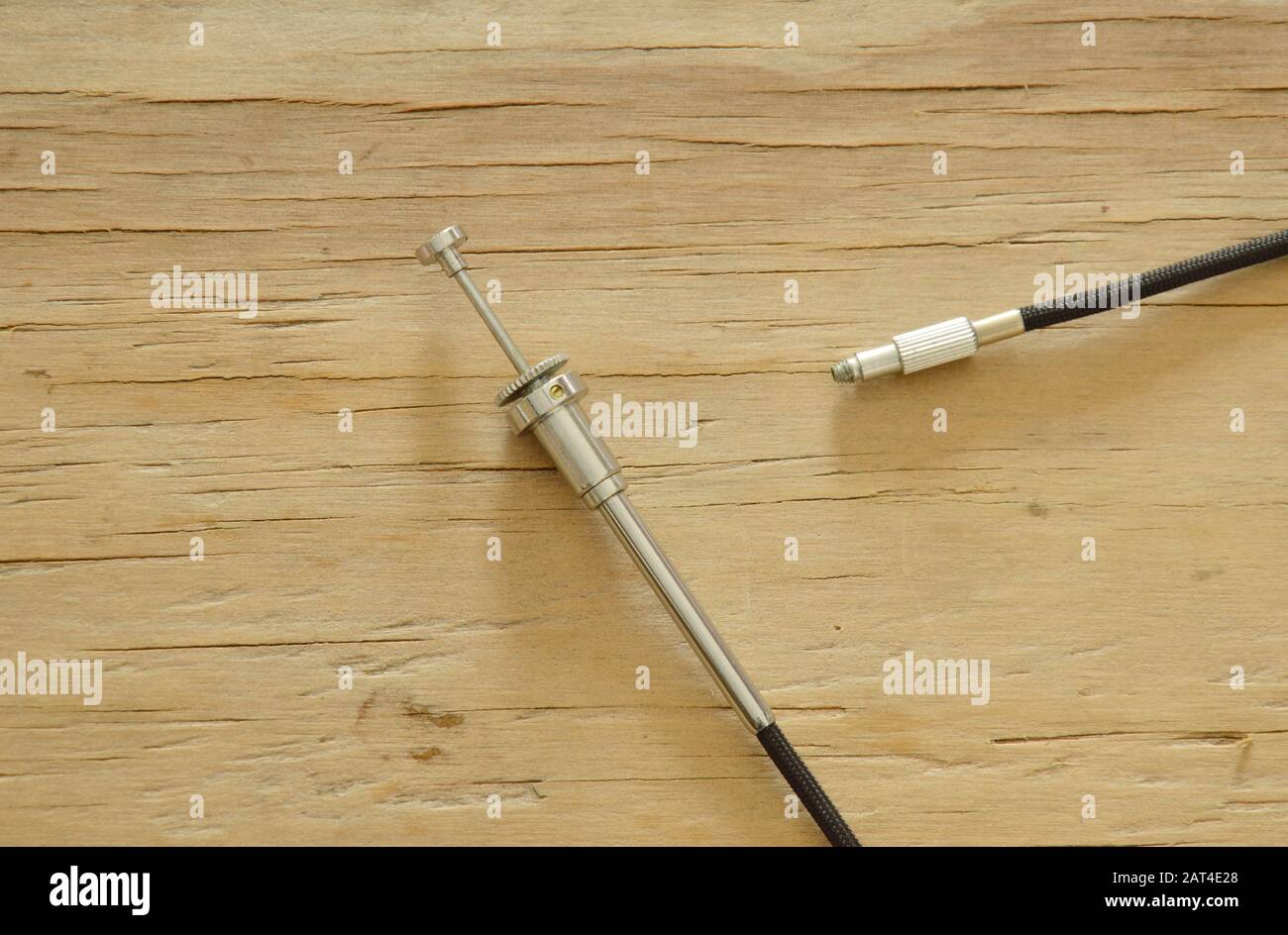 classic camera shutter cable released on wooden board Stock Photo Alamy