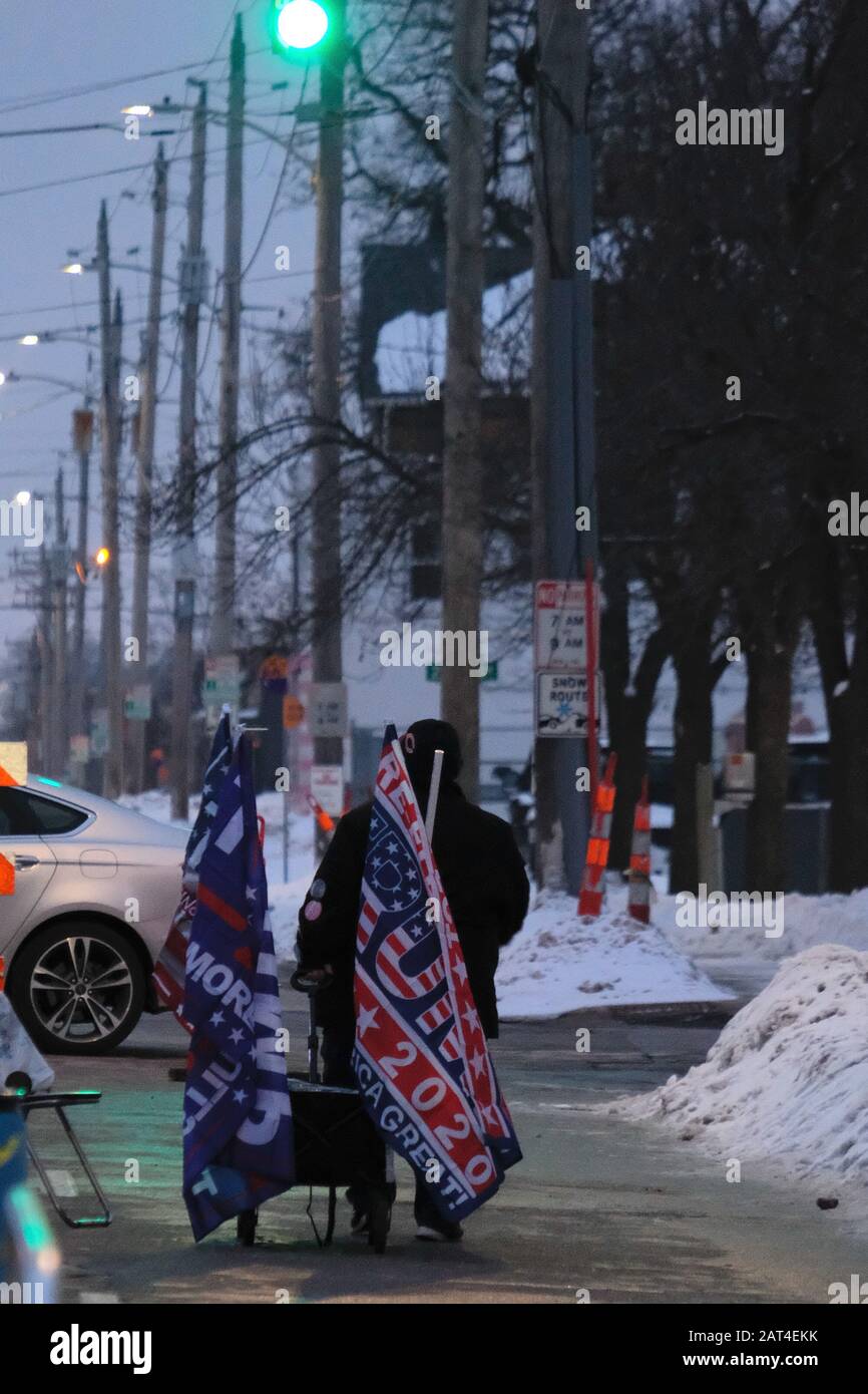 January 30, 2020, City, Iowa, U.S: A vendor pulls a wagon of merchandise outside the Drake University Knapp Center hours before President DONALD TRUMP is scheduled to speak there during a re-election rally on Jan. 30, 2020. The crowd began to gather during the day yesterday and some camped on the street overnight in 20 degree temperatures to be near the head of the admission line.  Admission tickets were offered on line on a first come - first served basis and having a ticket is not a guarantee of entrance to the event. The Knapp Center holds 7152 people. (Credit Image: © Fritz Nordengren/ZUMA Stock Photo