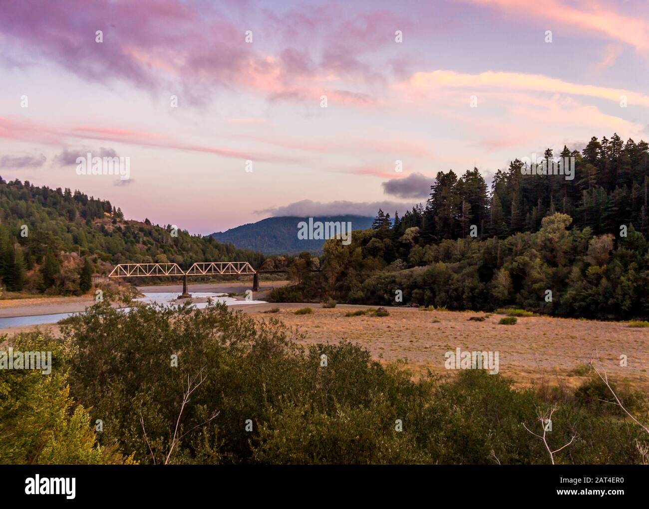 The eel river flows through a mostly dry river bed in a California