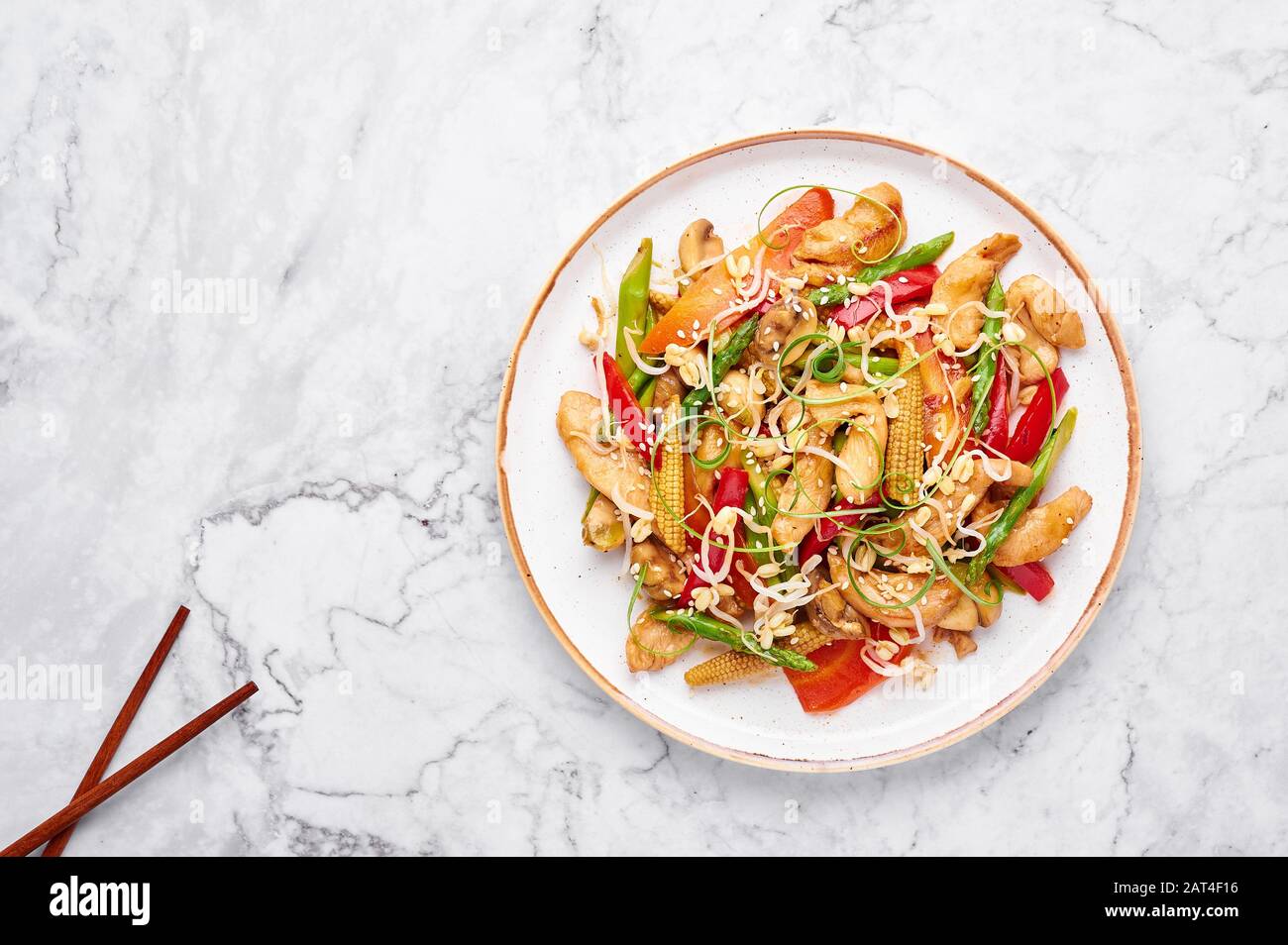 Chicken Chop Suey in white plate on marble background. Chop Suey is