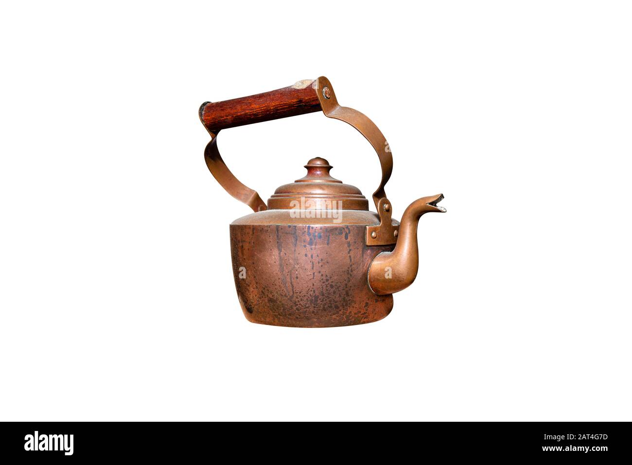 Vintage copper kettle with a wooden handle, isolated on a white