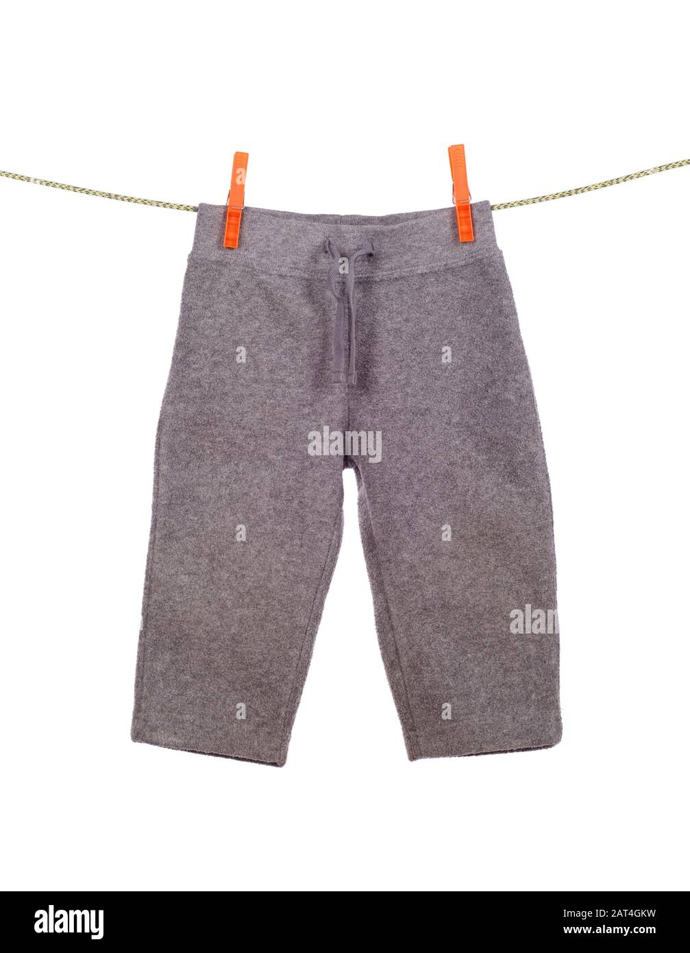 children's pants hanging on a clothesline on white Stock Photo Alamy