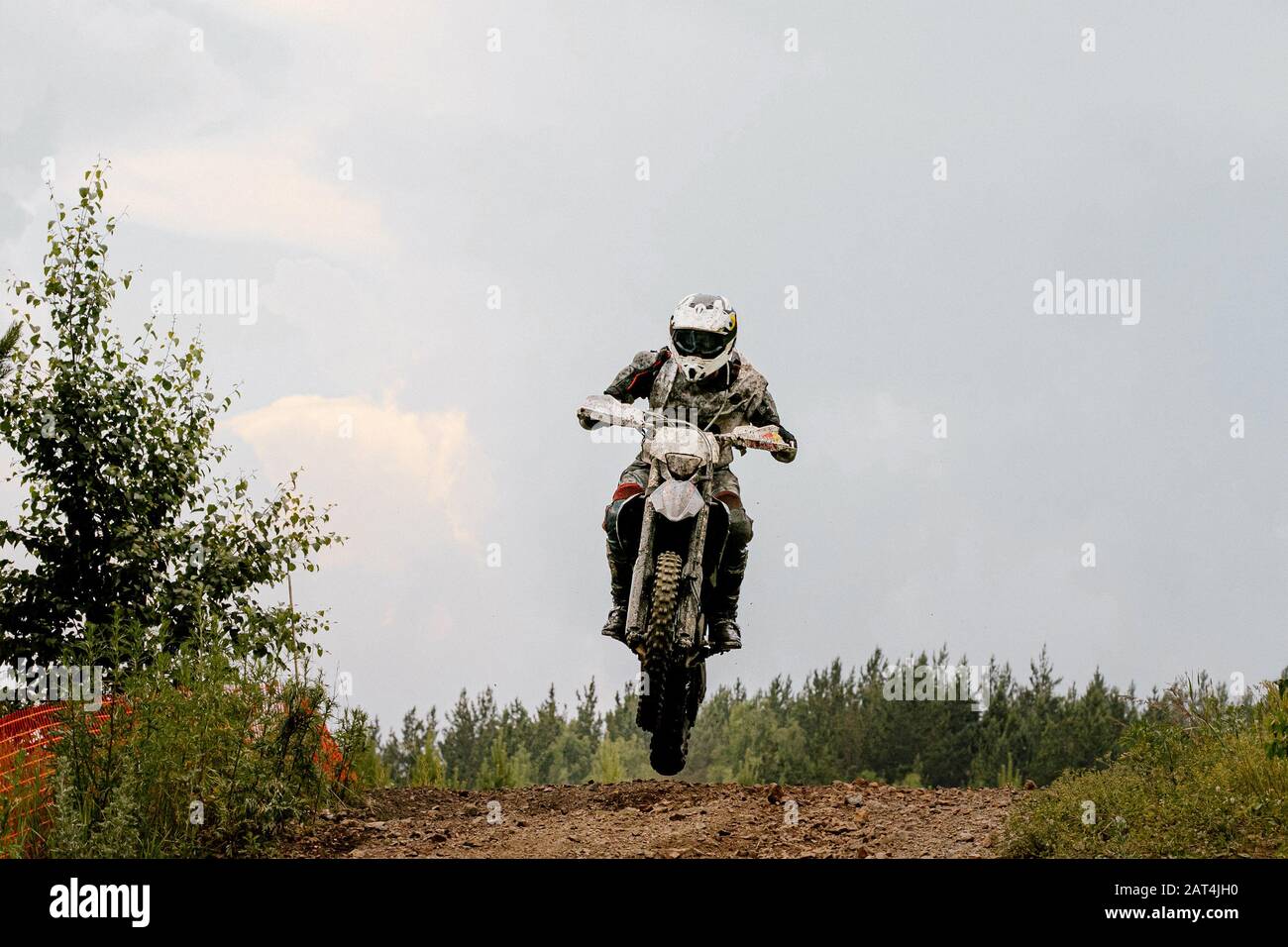 dirty motorcycle rider riding on trail motocross enduro Stock Photo Alamy