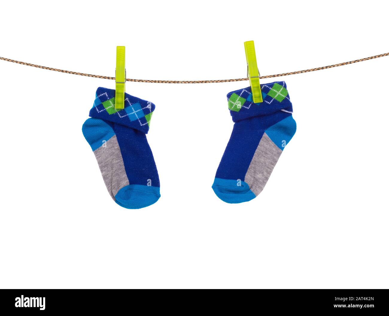 baby socks hanging on a clothesline Stock Photo Alamy