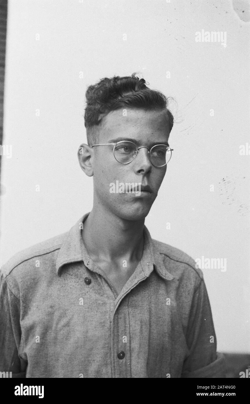Passport photos III  [Young man with glasses with shirt without shoulder epaulettes] Date: 1947 Location: Indonesia, Dutch East Indies Stock Photo