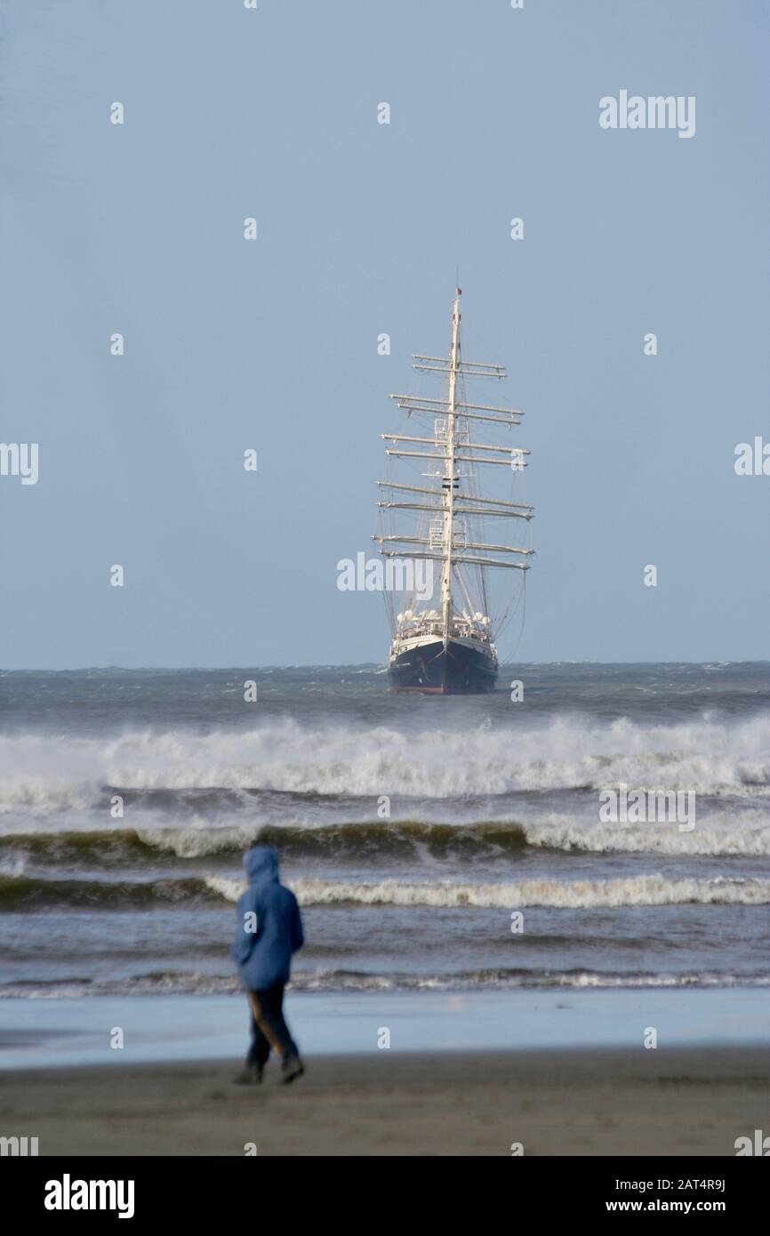 Sailing ship in stormy weather, Poppit Sands, Wales Stock Photo