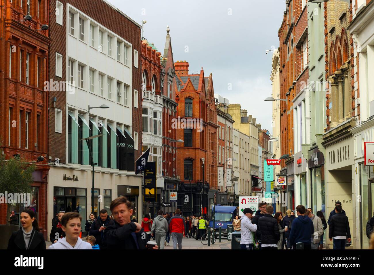 Dublin Ireland, February 19 2018: Large group of people walking on Dame St. This street is home to many business and close to Trinity. Stock Photo