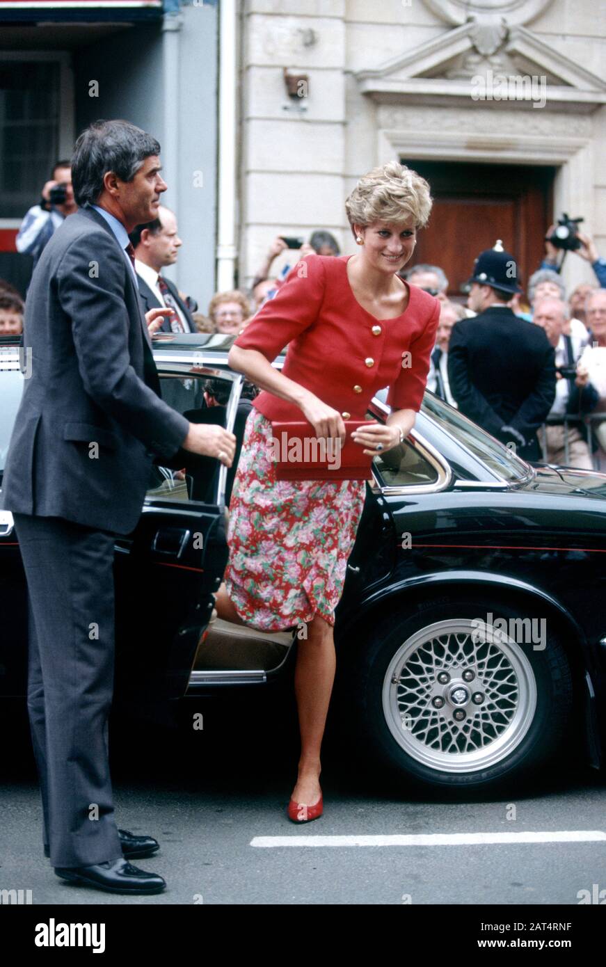 Colin Trimming-Royal protection officer opens the car door for Princess Diana, Devon, England May 1992 Stock Photo