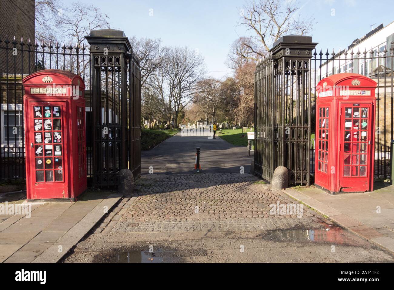 Red K6 telephone boxes by Sir Giles Gilbert Scot adorning the entrance to Brompton Cemetery, Fulham Road, Chelsea, London, SW10, England, U.K. Stock Photo