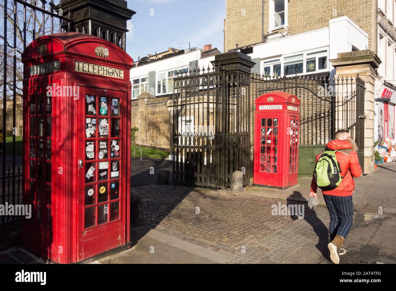 Red K6 telephone boxes by Sir Giles Gilbert Scot adorning the entrance to Brompton Cemetery, Fulham Road, Chelsea, London, SW10, UK Stock Photo