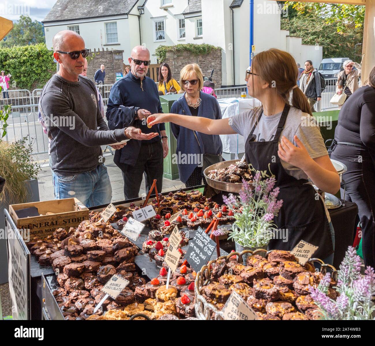 Buying brownies on stall at Abergavenny Food Festival, Wales, UK Stock Photo