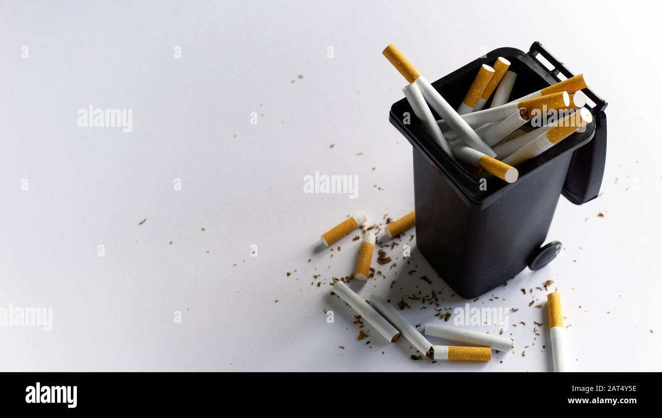 Throwing cigarettes to a trash bin quit smoking concept bad habit addiction Stock Photo Alamy