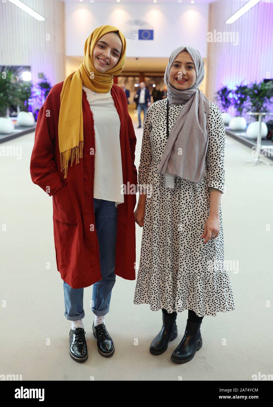 Parliamentary staff to the Green Party in Brussels Lara Alagha (left), aged 23, and Aya Delfi, aged 24, at the European Parliament building in Brussels, Belgium. Stock Photo
