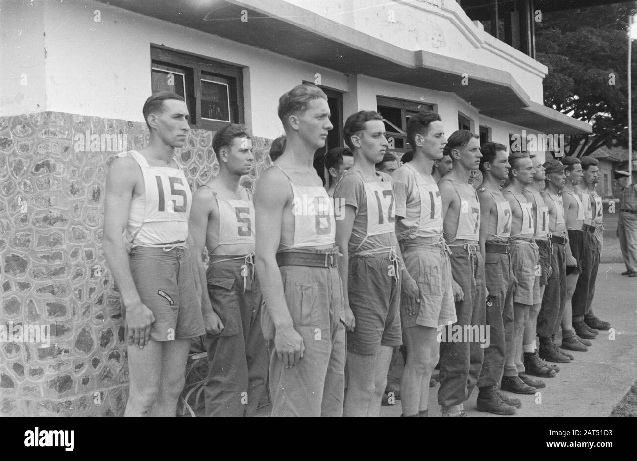 Officials Selection Centre  Candidate officers standing up. They wear numbers Date: October 1946 Location: Bandung, Indonesia, Dutch East Indies Stock Photo