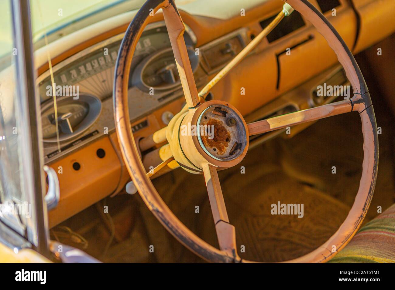 The steering wheel in an old derelict Ford Eds el in Seligman, Arizona. Stock Photo