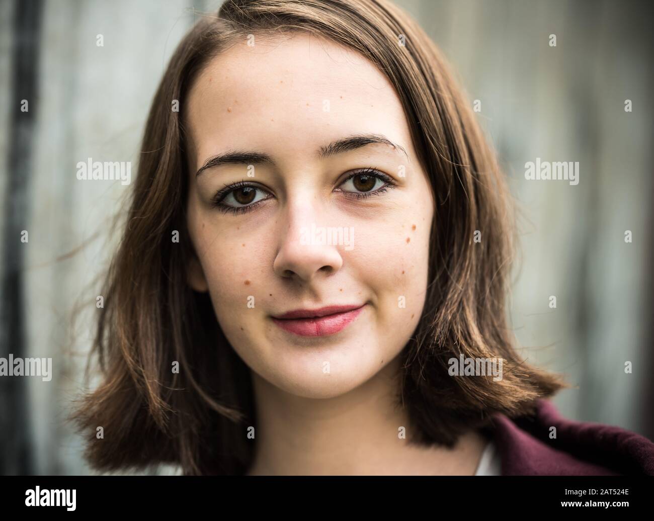 Headshot Of A 17 Year Old College Girl With A Hoody Posing Against A
