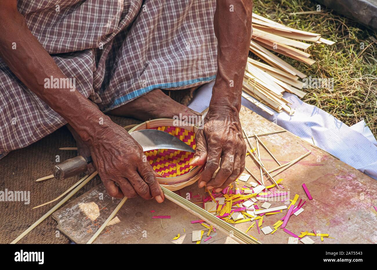 Local craftsman working on the creation of handicraft items for sale at a craft fare at Kolkata, India Stock Photo