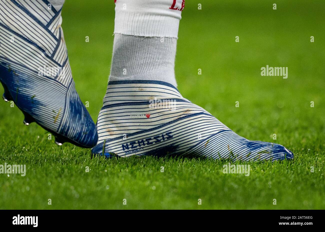 London, UK. 29th Jan, 2020. The Adidas Nemesis football boots of Roberto  Firmino of Liverpool displaying FAMILIA & Love Heart during the Premier  League match between West Ham United and Liverpool at