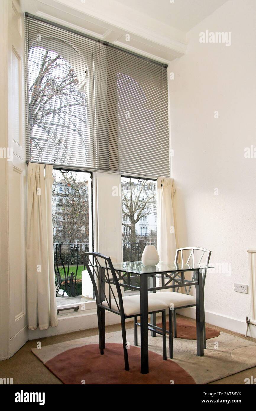 Interior shot of dining room in small apartment Stock Photo - Alamy